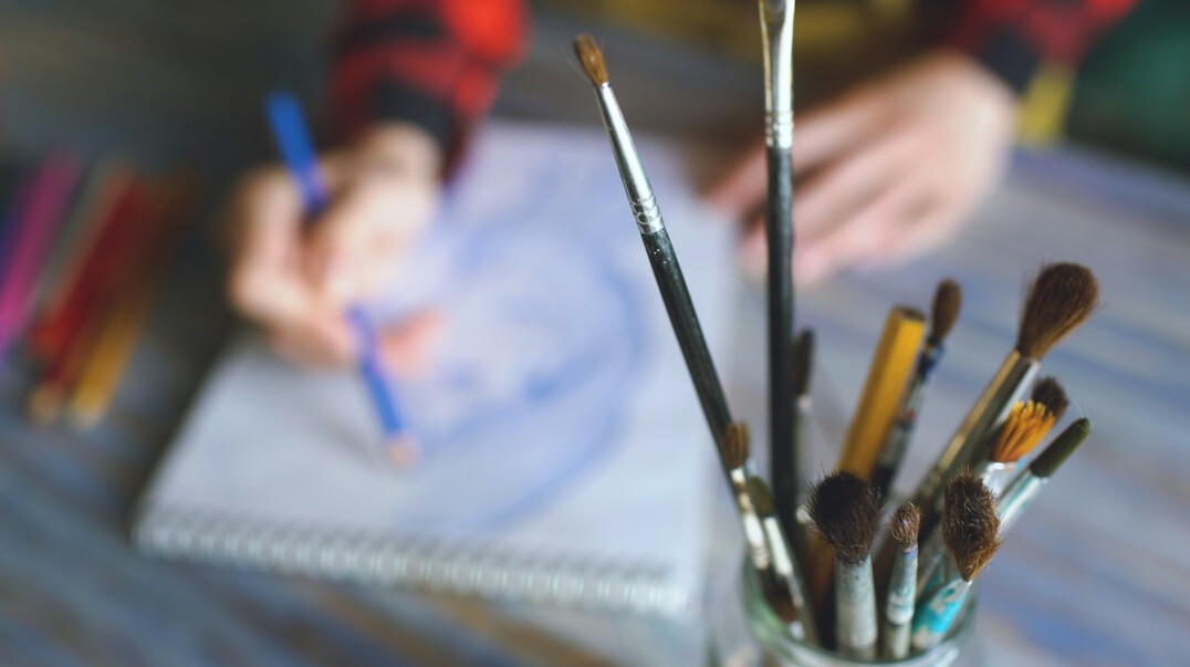 Hand writing with a pen in a notebook